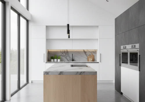 A sleek modern kitchen featuring a marble island and large windows.