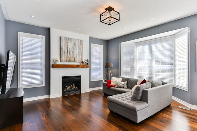 A stylish modern living room featuring a cozy fireplace and contemporary furniture.